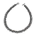 Freshwater pearls and handmade oxidised silver beads create this statement necklace. Perfect for livening up work attire or complementing evening wear.