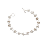 Silver domed disc are intricately connected to silver pillar-like bars. An interesting, unique bracelet that will match every outfit and occasion.