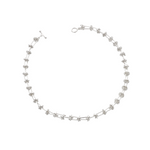 Soft, silver domes are connected by silver pillar-like bars. The unique design looks structured yet it feels soft to the touch.