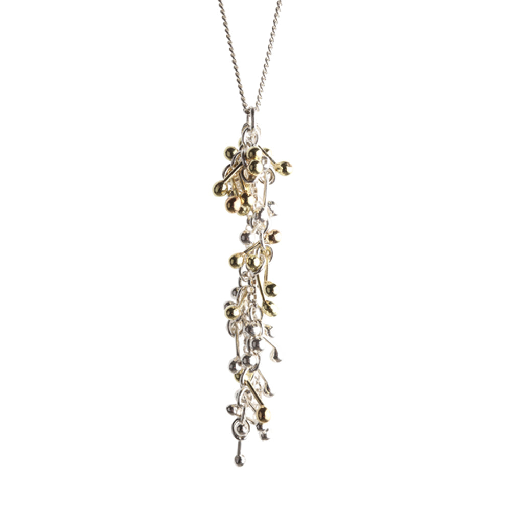 A shower of gold and silver molecular elements hang from a silver chain. Yen Jewellery