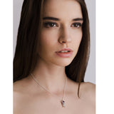 Model wears Molecule Ruby Drop Necklace. A ruby set in a cluster of handmade silver beads.