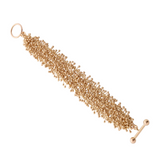 An 18ct yellow gold bracelet that consists of intricately constructed tiny molecules. Rich and sumptuous to the touch, this bracelet is a luxurious take on Yen Jewellery's classic Molecule range.