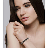 Model wears oxidised silver and freshwater pearl bracelet. Handmade by Yen Jewellery