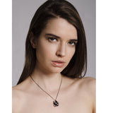 Model wearing a cluster of freshwater pearls and oxidised silver components. All components are handmade by Yen Jewellery.