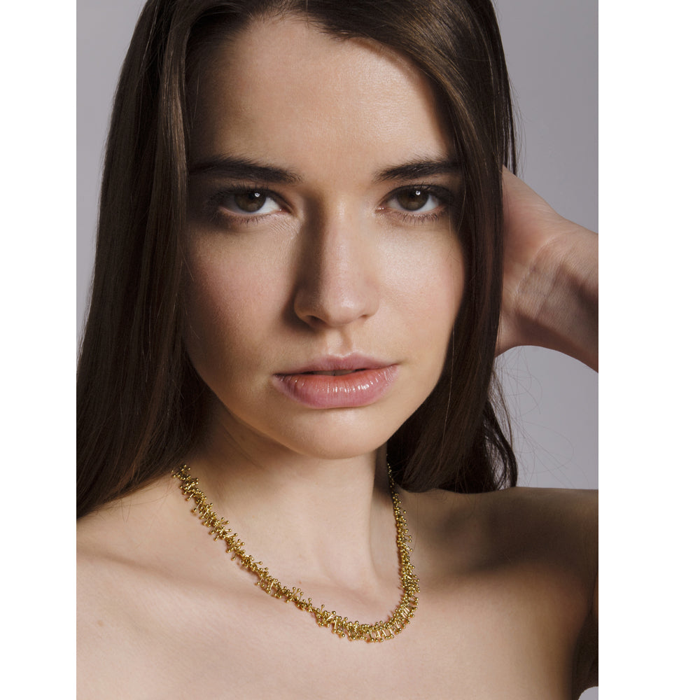 Model wears 18ct gold choker necklace. Handmade by Yen Jewellery