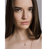 Model wears silver cluster necklace. Cluster hangs centrally from a silver chain. Handmade by Yen Jewellery